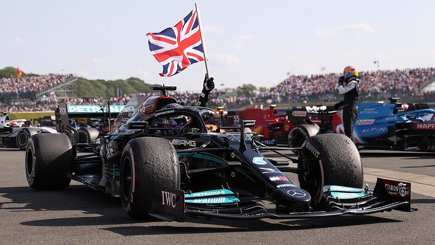 Mercedes' British driver Lewis Hamilton celebrates after winning the Formula One British Grand Prix motor race at Silverstone motor racing circuit in Silverstone, central England on July 18, 2021.