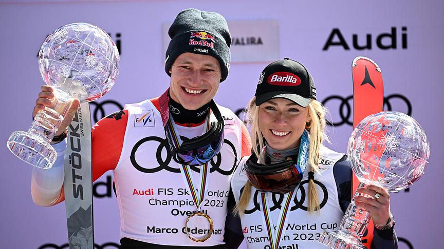 Winners of the overall general standing, Switzerland's Marco Odermatt and USA's Mikaela Shiffrin pose with their globe during the podium ceremony of the FIS Ski World Cup in El Tarter, Andorra on March 19, 2023