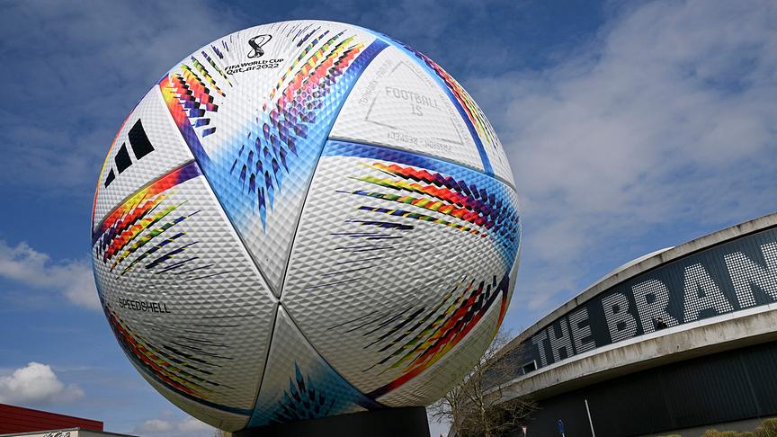Picture taken on April 21, 2022 on the compound of the headquarters of German sports equipment maker Adidas in Herzogenaurach, southern Germany, shows an oversized model of the official football of the Qatar held 2022 FIFA Football World Cup called "Al Rihla", meaning "The Journey".